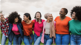 seven women happily smiling at the camera